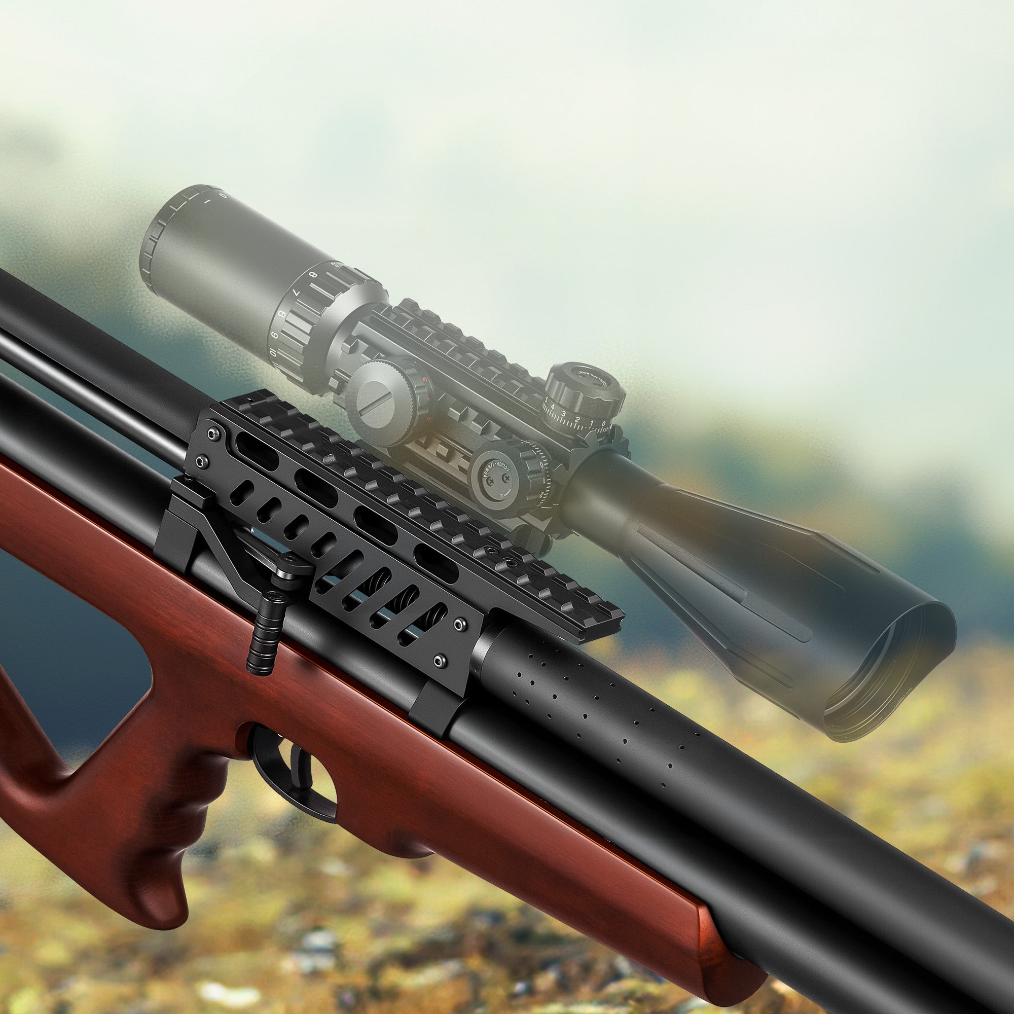 Riflescope mounted on a rifle with a blurred natural background