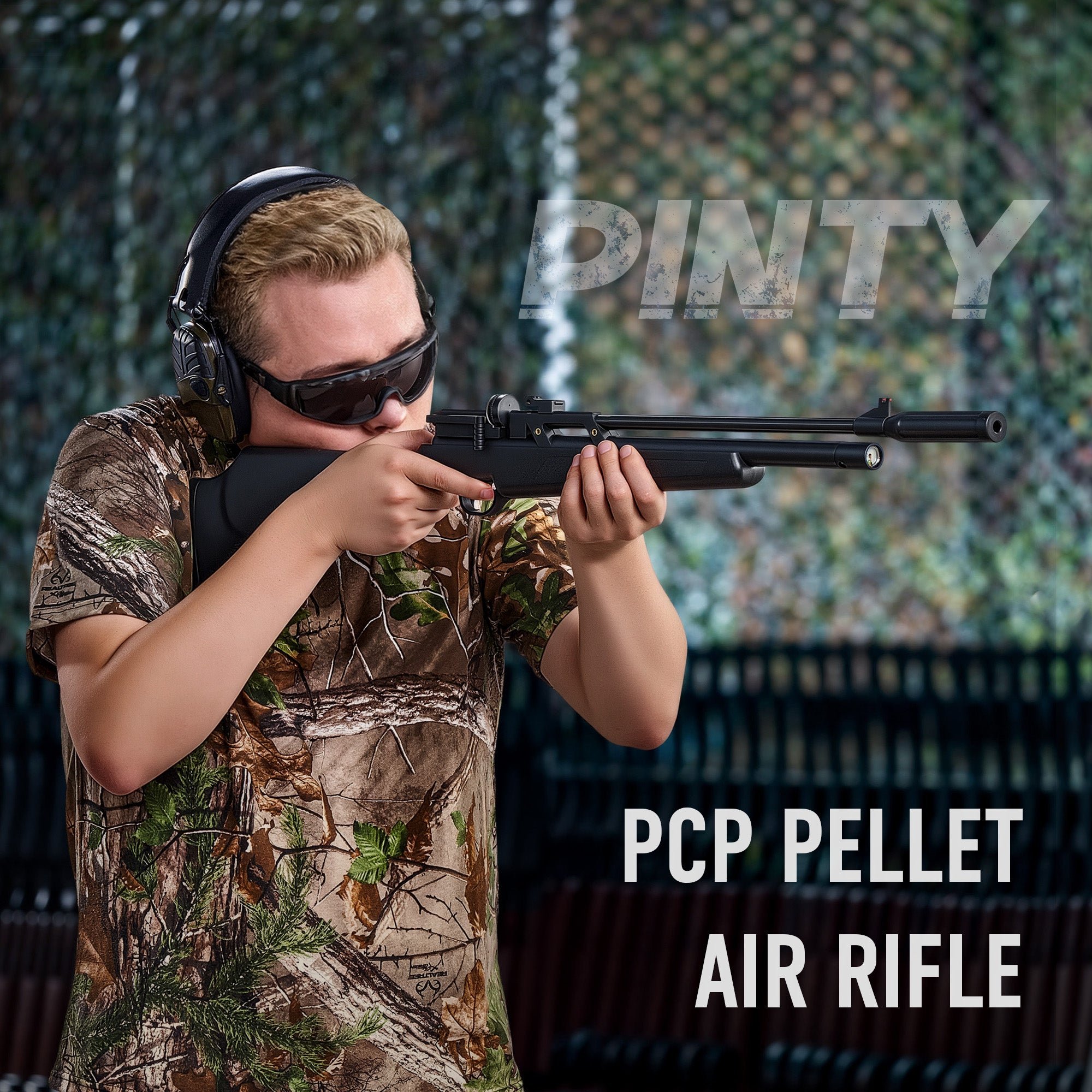 Person in camouflage attire holding a PCP pellet air rifle with 'Pinty' branding.