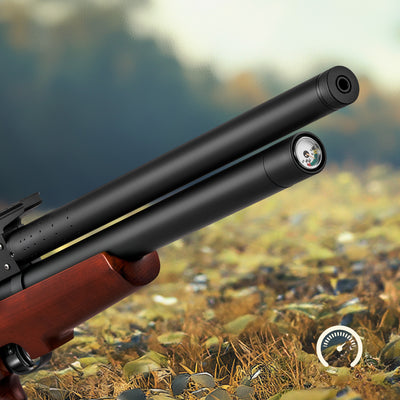 Close-up of a rifle with a scope against a natural background