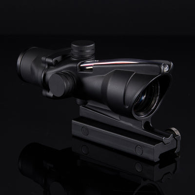 Black rifle scope on a reflective black surface with a dark background