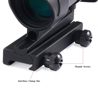 Close-up of a black rifle scope with interface clamp bar and thumb screws on a white background